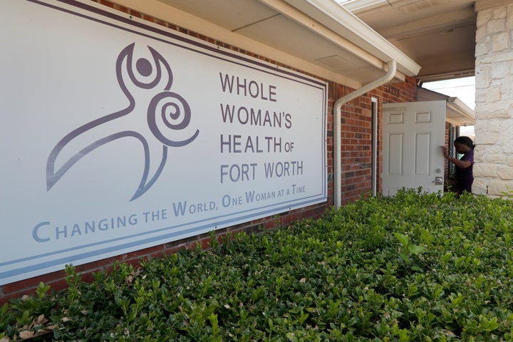 Clinic manager Angelle Harris walks in the front door of the Whole Woman's Health clinic in Fort Worth, Texas, Sept. 4, 2019. Faced with drives of four hours or more to Fort Worth, Dallas, El Paso or out-of-state clinics, many women in West Texas and the Panhandle need at least two days to obtain an abortion — a situation that advocates say exacerbates the challenges of arranging child care, taking time off work and finding lodging. Some end up sleeping in their cars. (AP Photo/Tony Gutierrez)