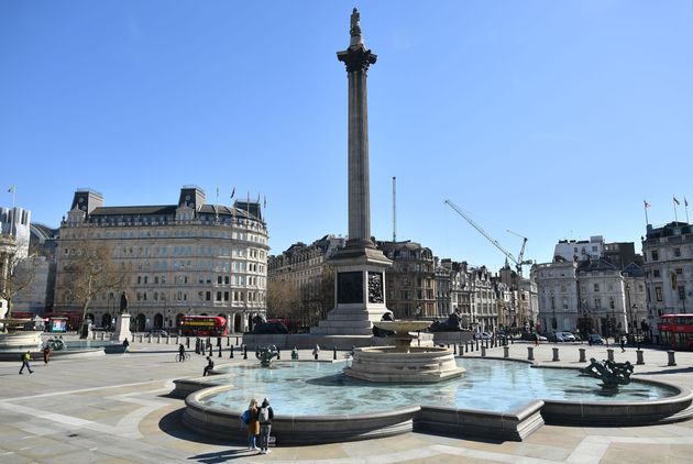 A near empty Trafalgar Square is pictured in the sunshine at lunch time, central London, March 23, 2020,...