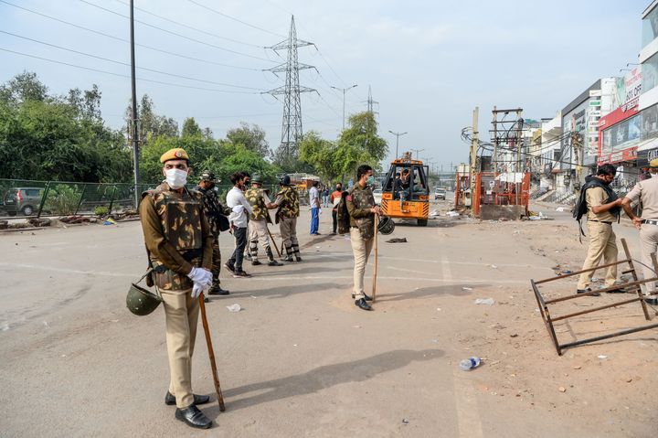 Security personnel patrol on the streets in Shaheen Bagh area after removing demonstrators on March 24, 2020.