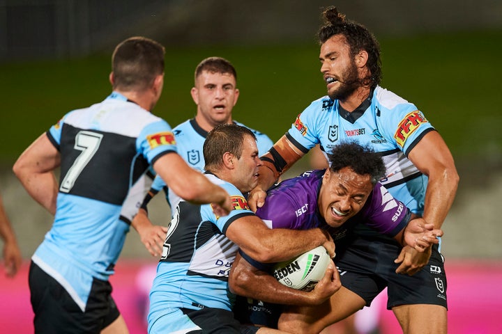 Felise Kaufusi of the Storm is tackled during the round 2 NRL match between the Cronulla Sharks and the Melbourne Storm at Netstrata Jubilee Stadium on March 21, 2020 in Sydney, Australia.