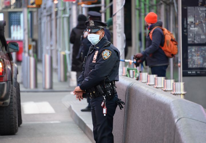 An NYPD police officer wears a protective face mask in Times Square on March 22.