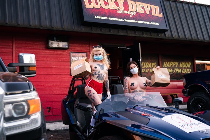 Axel and Poni Noel, two dancers at Lucky Devil Lounge. The staff there has come up with an inspired way to keep business going during the coronavirus outbreak.