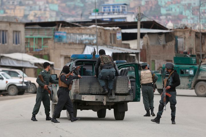 Afghan personnel arrive at the site of an attack in Kabul, Afghanistan, on March 25, 2020.