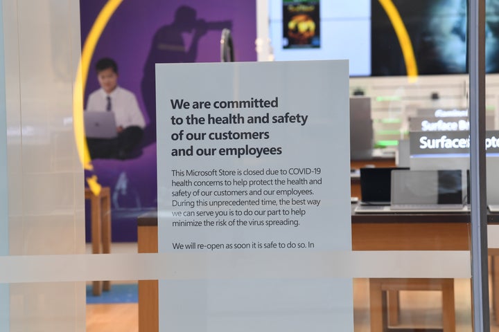 A sign informing customers that the Microsoft store is closed on Pitt Street mall on March 21, 2020 in Sydney, Australia. 