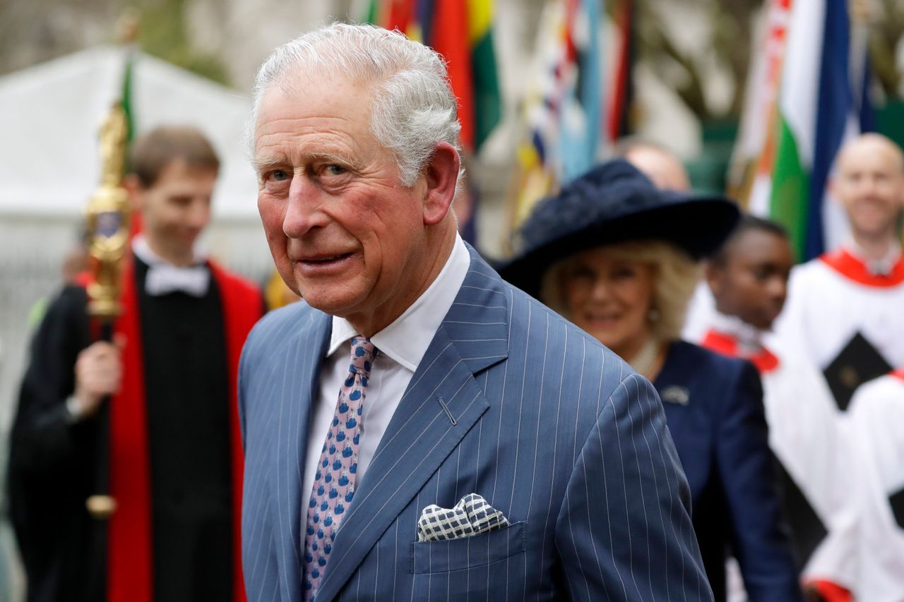 Prince Charles and Camilla the Duchess of Cornwall, in the background, leave after attending the annual Commonwealth Day service at Westminster Abbey earlier this month.
