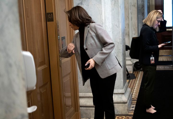 U.S. Senator Kamala Harris presses an elevator button with her elbow at the U.S. Capitol last week.