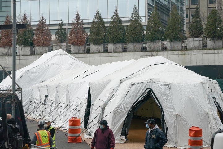 Workers build a makeshift morgue outside of Bellevue Hospital to handle an expected surge in coronavirus victims on March 25,