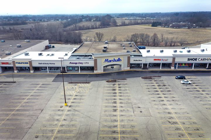 ROCKFORD, ILLINOIS - MARCH 24: The parking lot is nearly deserted at Forest Plaza on March 24, 2020 in Rockford, Illinois. 