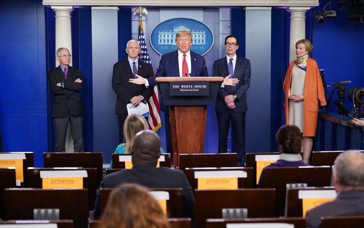 President Donald Trump is joined by (from right) White House Coronavirus Task Force coordinator Deborah Birx, U.S. Treasury Secretary Steven Mnuchin, U.S. Vice President Mike Pence and Director of the National Institute of Allergy and Infectious Diseases Anthony Fauci during the daily briefing on COVID-19 at the White House on March 25, 2020.