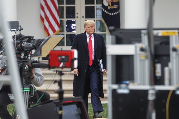 President Donald Trump arrives at a Fox News "virtual town hall" event with members of the coronavirus task force in the Rose Garden of the White House in Washington, U.S., March 24, 2020.
