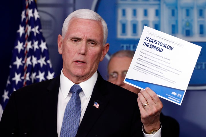 Vice President Mike Pence holds up a card about coronavirus prevention in the James Brady Briefing Room on March 24, 2020, in Washington. 