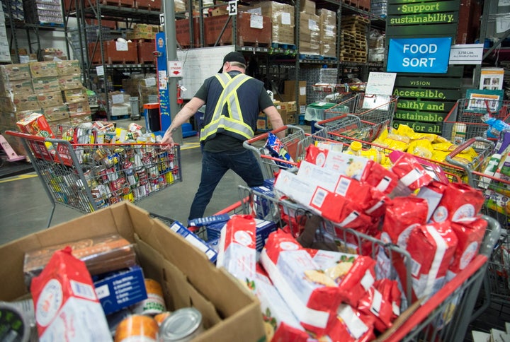 Staff at the Greater Vancouver Food Bank prepare food in Burnaby, British Columbia on March 18, 2020.