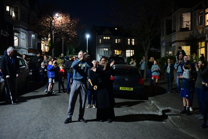 People in Woodford Green join in a national applause for the NHS from their doorsteps, windows and balconies