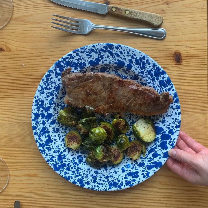 A steak and roasted Brussels sprouts Slone's boyfriend made. "He works in fine dining, so frozen chicken nuggets probably won't cut it," she said.