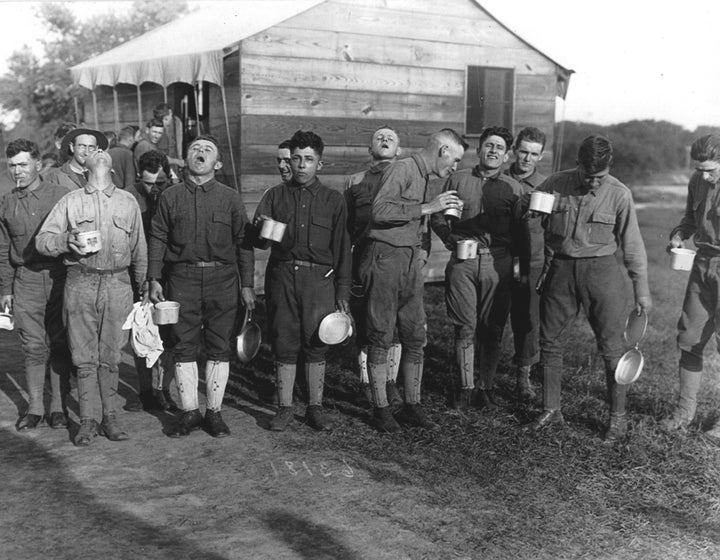 Men gargle with salt and water as a preventive measure against the influenza epidemic at Camp Dix, New Jersey, in September 1918.