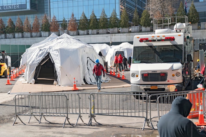 Workers build a makeshift morgue outside of Bellevue Hospital in New York City. The COVID-19 outbreak has quickly overwhelmed