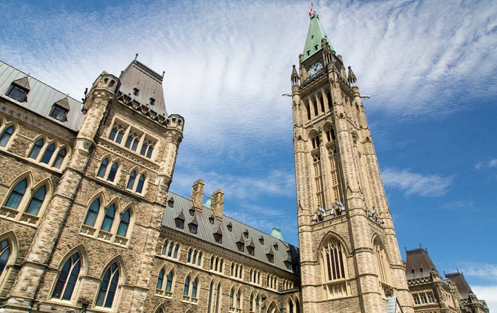 In this stock photo, the spires of the central block of Parliament in Ottawa are seen on a sunny day. Stimulus spending in response to the novel coronavirus pandemic may not do much to fire up the economy, the PBO noted. 