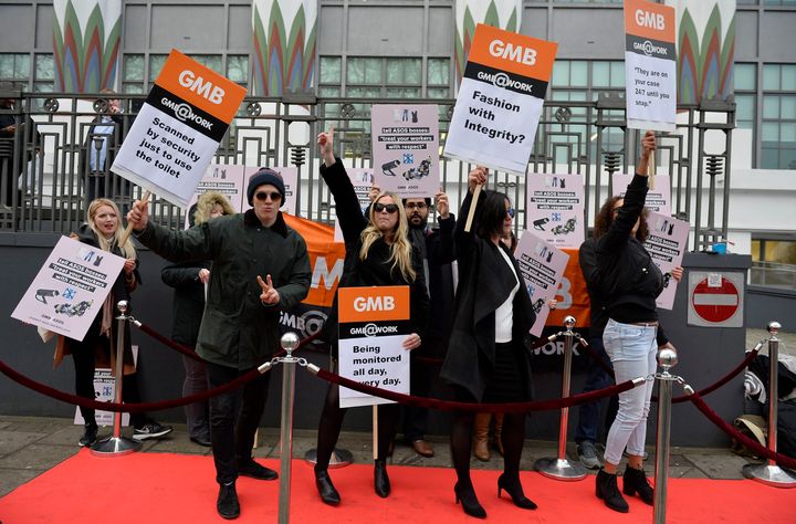 The GMB union holds a "Catwalk of Shame" protest in 2016 outside the Asos headquarters in London about the conditions in the company's Barnsley warehouse. The company is now under fire from the same union for letting staff keep working despite social distancing rules
