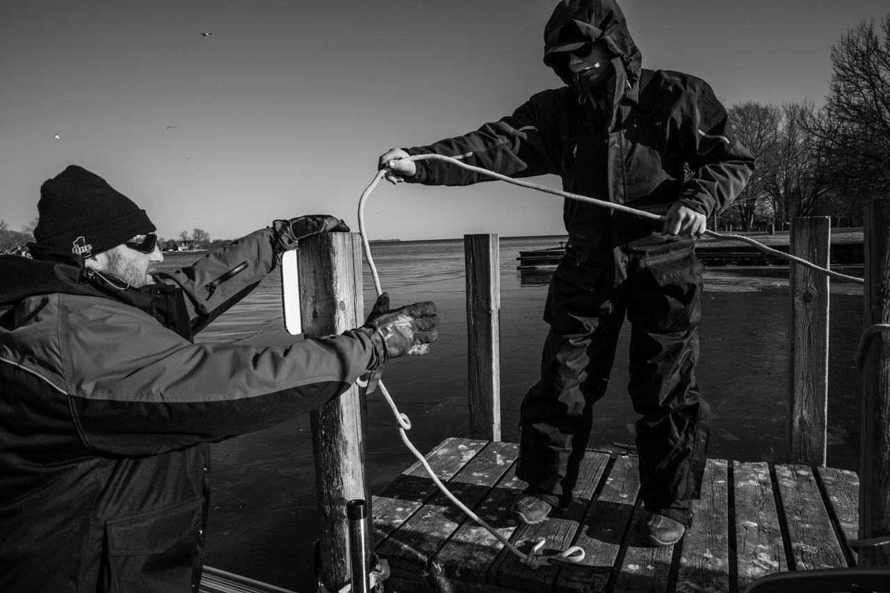 George Cini Sr. and George Cini Jr. take their boat out to fish on the waters of Lake Erie on Feb. 22. The air is frigid, but the water is mostly ice-free and open.