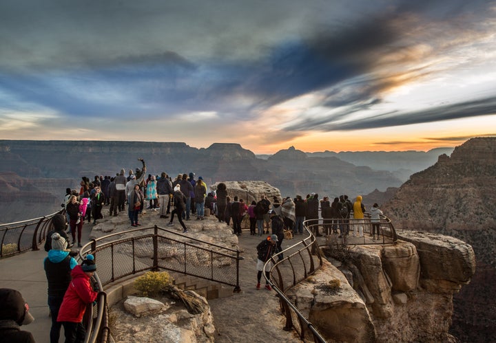 In response to the COVID-19 outbreak, Grand Canyon National Park is waiving entrance fees to protect gate attendants from exposure and closing some trails and campsites to prevent crowds like these.