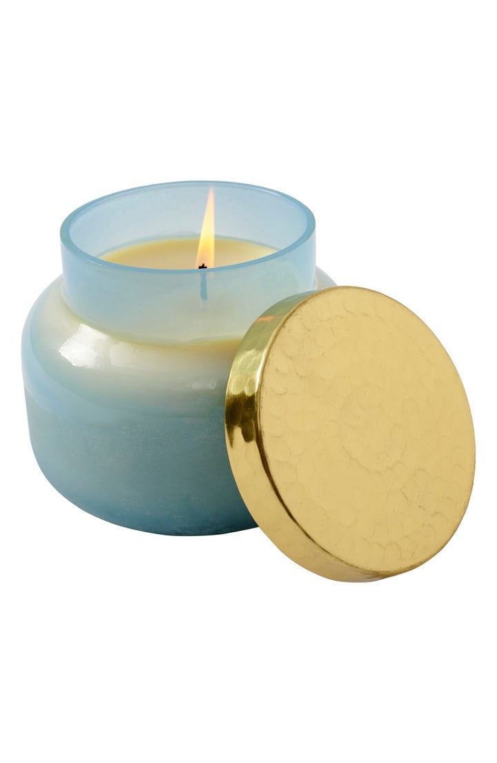 A hand-poured candle presented in a beautiful lidded vessel fills your home with an enticing scent.