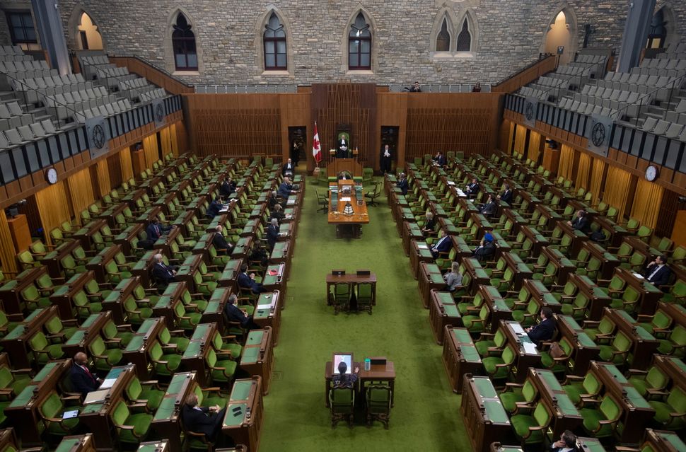 Members of the House of Commons attend an emergency sitting on March 24, 2020 in Ottawa. 