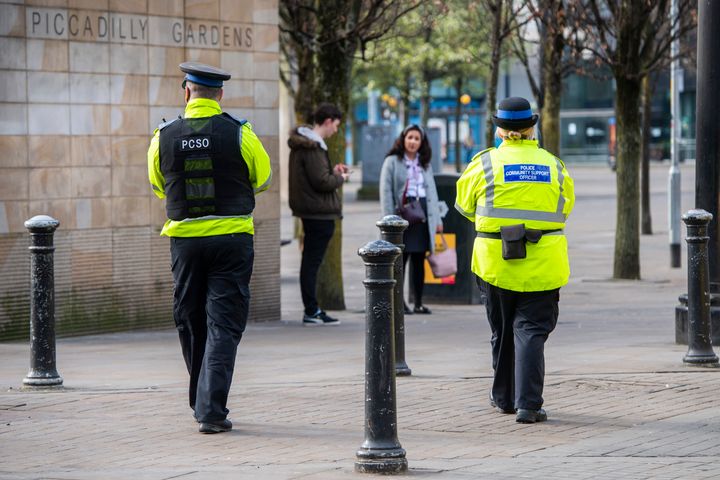 Police Community Support officers patrol Piccadilly Gardens in central Manchester.