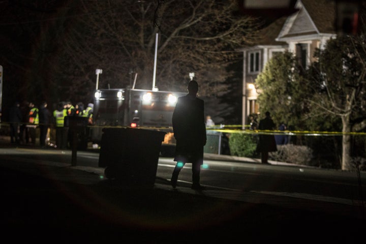 Authorities and first responders gather in front of a residence in Monsey, N.Y., following a stabbing late Saturday during a Hanukkah celebration.