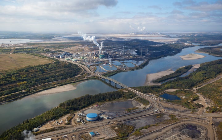 In this undated stock photo, an aerial view of a large oil refinery is seen along the Athabasca River near Fort McMurray, Alta.