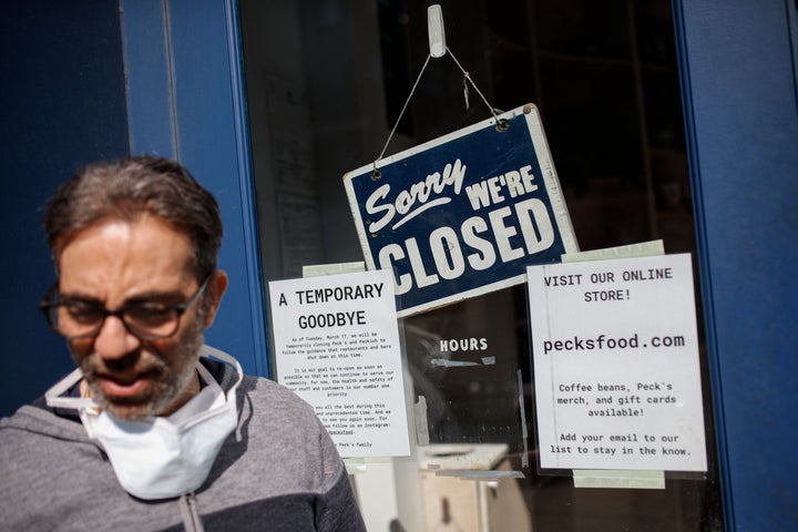 Peck's Food owner Theodore Peck stands outside his closed business on March 18, 2020, in Brooklyn's Clinton Hill neighborhood in New York City.