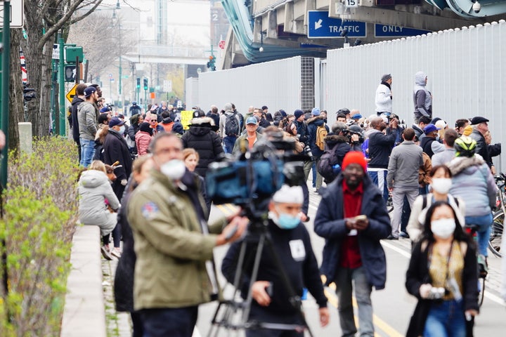 A crowd seen gathering to welcome US Navy hospital ship at New York City on March 30, 2020.