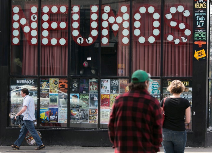 Pedestrians walk past Neumos music club in Seattle on April 10, 2014. “Taking a loan right now is ludicrous until everybody understands it,” said Steven Severin, owner and operator of Neumos.