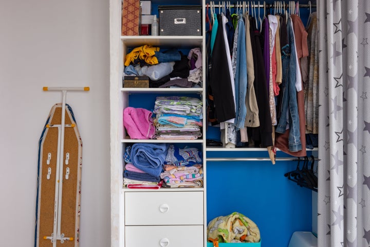 To start cleaning you closet, begin by sorting clothes into three piles: donate, repair and keep. 