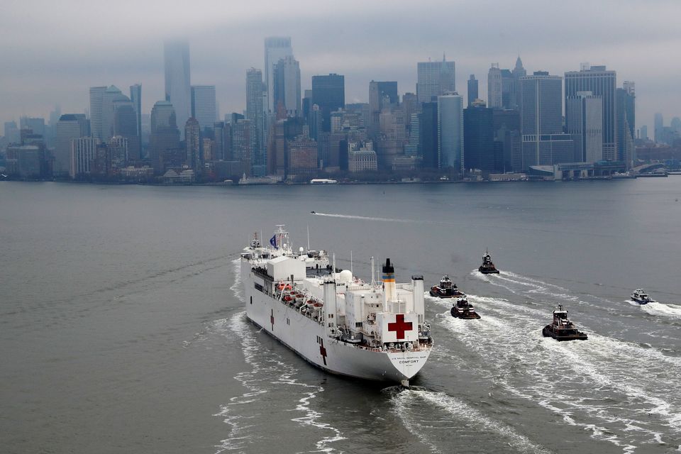 The USNS Comfort passes Manhattan as it enters New York Harbour.