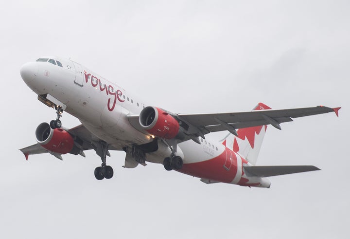 An Air Canada Rouge jet takes off at Montreal's Trudeau International Airport on March 20, 2020, as coronavirus infections rise in Canada and around the world.