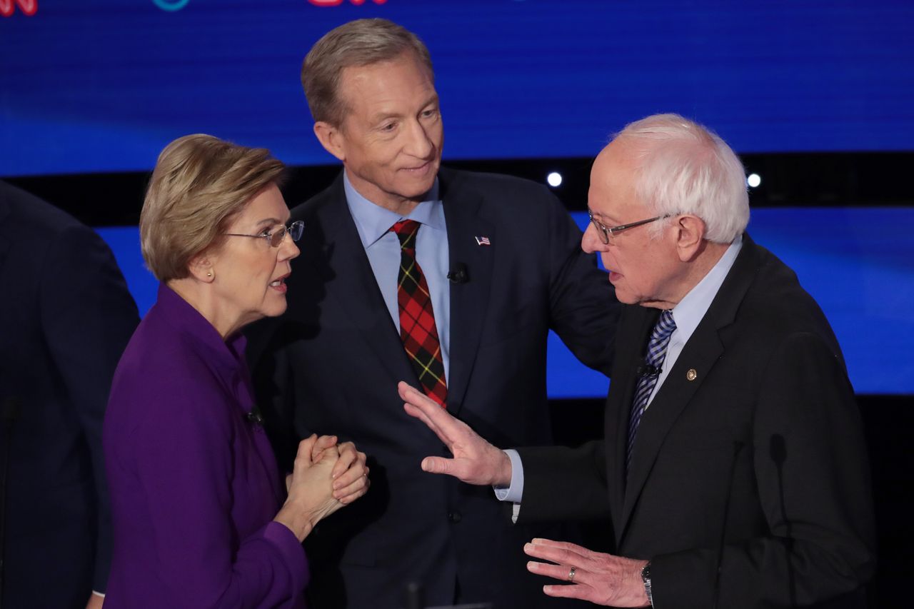 Sen. Elizabeth Warren (D-Mass.), left, and Sanders, right, have a tense conversation after the Jan. 14 debate as Tom Steyer looks on. The two progressives' rift loomed over the campaign.