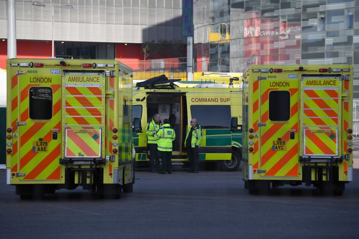 Ambulances personnel outside the ExCel center that is being turned into a 4000 bed temporary hospital for coronavirus patients in London