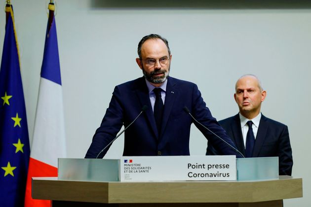 French Prime Minister Edouard Philippe speaks, flanked by French Director General of Health Jerome Salomon, as he announces new measures to limit the spread of Covid-19, on March 14, 2020, in Paris.