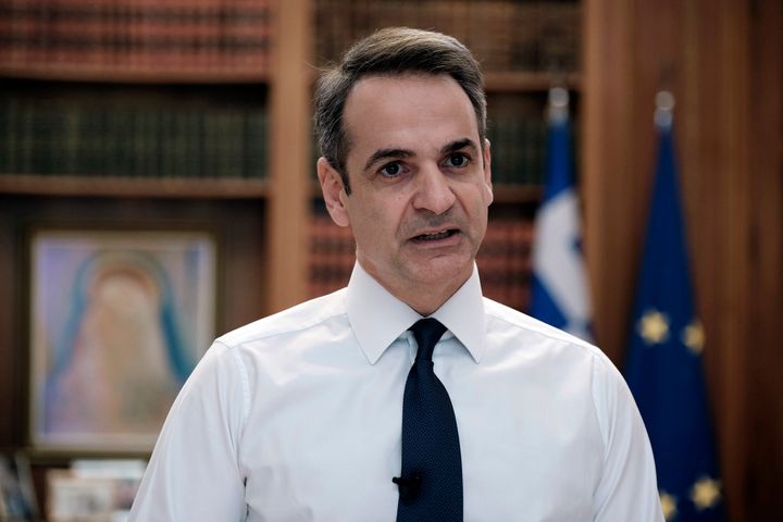 In this photo provided by the Greek Prime Minister's Office, Greece's Prime Minister Kyriakos Mitsotakis addresses the Greek nation on State TV in Athens, Sunday, March 22, 2020. Mitsotakis has announced a lockdown, starting at 6 a.m. (03.00 gmt) Monday. All citizens and residents must stay at home, or risk a 150-euro fine. The vast majority of people recover from the new coronavirus. According to the World Health Organization, most people recover in about two to six weeks, depending on the severity of the illness. (Dimitris Papamitsos/Greek Prime Minister's Office via AP)
