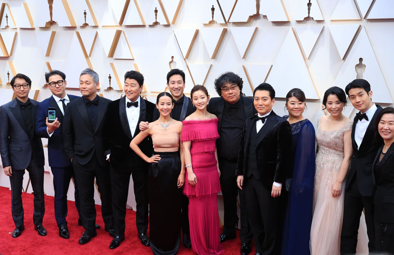 Director Bong Joon-ho (sixth from the right) and cast and crew members of the film "Parasite" at this year's Academy Awards in Los Angeles on Feb. 9. The movie made history as the first foreign-language film to win the Oscar for Best Picture.