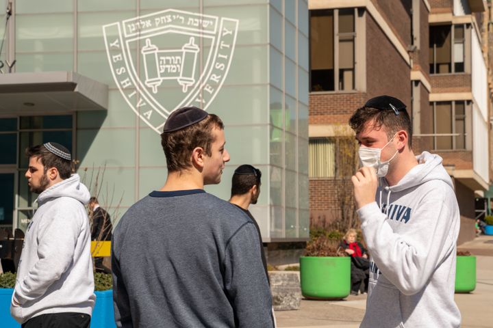 A Yeshiva student wears a face mask on the grounds of the university on March 4, 2020, in New York City after a student at the school tested positive for COVID-19.