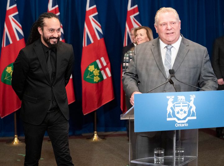 Doug Ford thanks ASL interpreter Christopher Desloges for his work at a daily briefing at Queen's Park on April 1, 2020.