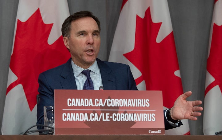 Minister of Finance Bill Morneau responds to a question during a news conference in Ottawa on March 27, 2020.