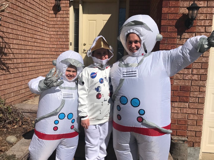 Poppy Anderson, left, Atlas Anderson, centre, and mom Kat Anderson dress up in costume for a neighbourhood stroll. 