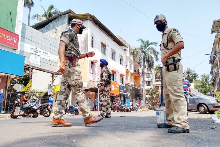 Paramilitary soldiers patrol along a street during a government-imposed nationwide lockdown as a preventive measure against the COVID-19 coronavirus in Goa on March 29, 2020. 