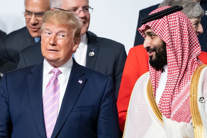 President Donald Trump and de facto Saudi ruler Crown Prince Mohammed bin Salman stand side by side in the group picture at the start of the G20 summit in Osaka, Japan, in June 2019.
