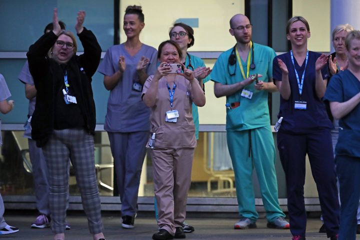 Staff from the Royal Liverpool University Hospital join in a national applause during Thursday's nationwide 'clap for carers'.