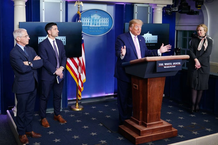 US President Donald Trump gestures as he speaks, flanked by Director of the National Institute of Allergy and Infectious Diseases Anthony Fauci (L) and Response coordinator for White House Coronavirus Task Force Deborah Birx (R), during the daily briefing on the novel coronavirus, COVID-19, in the Brady Briefing Room at the White House on April 1, 2020, in Washington, DC. (Photo by MANDEL NGAN / AFP) (Photo by MANDEL NGAN/AFP via Getty Images)