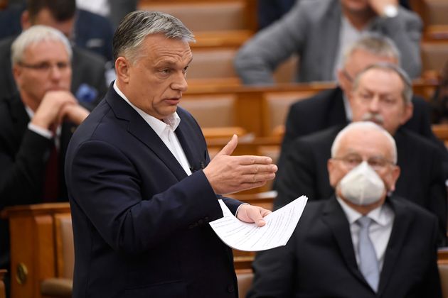 Hungarian Prime Minister Viktor Orban delivers his speech about the current state of the coronavirus outbreak during a plenary session in the House of Parliament in Budapest, Hungary, Monday, March 23, 2020. (Tamas Kovacs/MTI via AP)