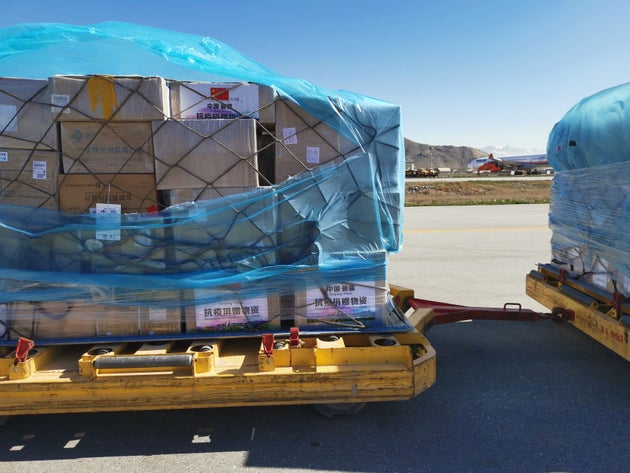 China-donated medical supplies are unloaded in Kabul, Afghansitan, April 2,